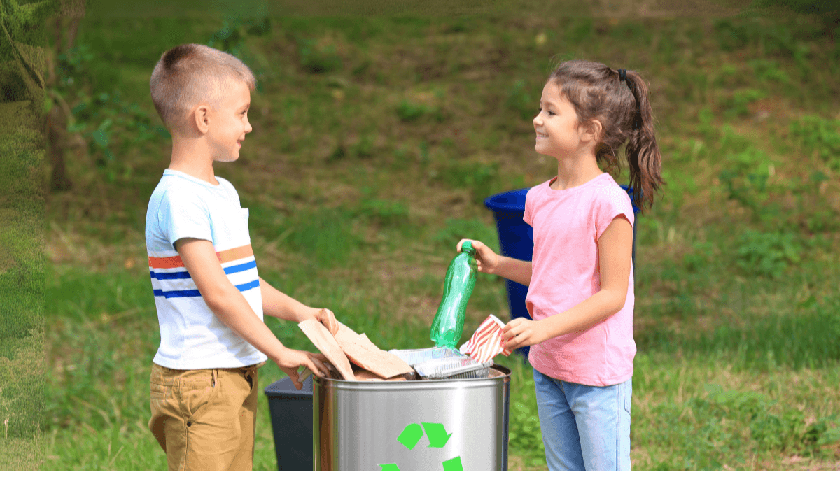 Children sorting recycling into a bin outdoors to learn about waste and the environment